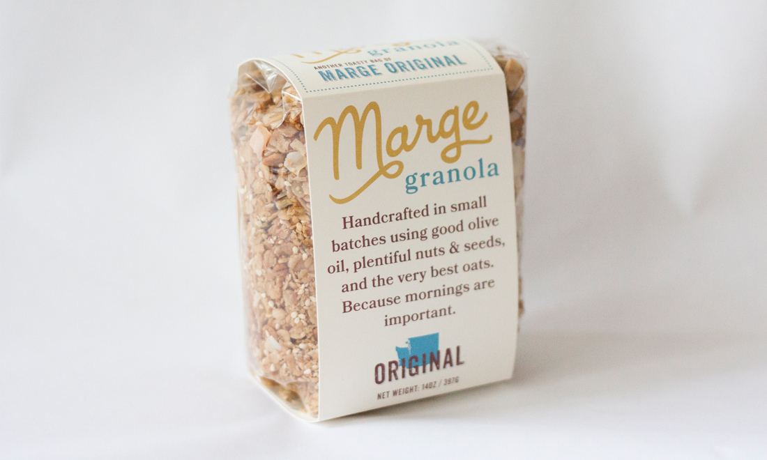 Original Marge Granola packaging with clear view of granola and unique label wrapping around the pouch.