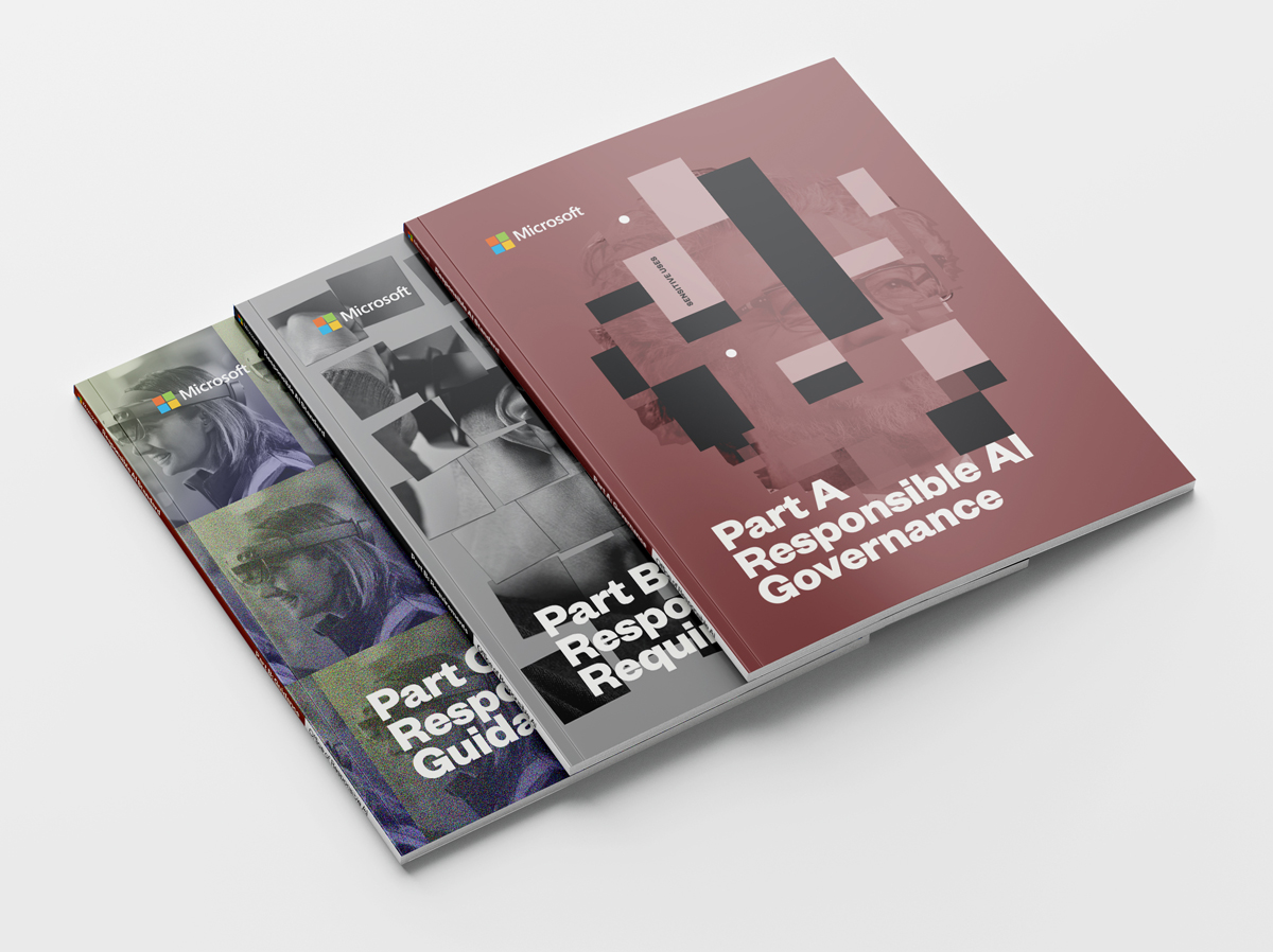 Photograph of three volumes of Microsoft’s Responsible AI Standard with clean, structured editorial design.